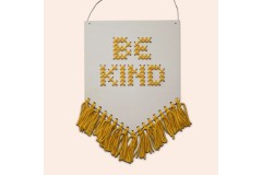 Cotton Clara - 'Be Kind' Tasseled Wooden Banner - Mustard (Cross Stitch Kit)